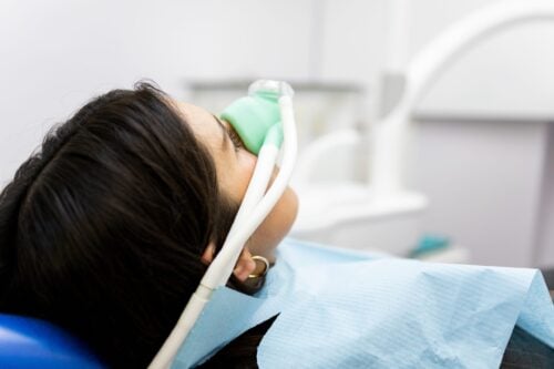 patient undergoing sedation during a modern dental treatment